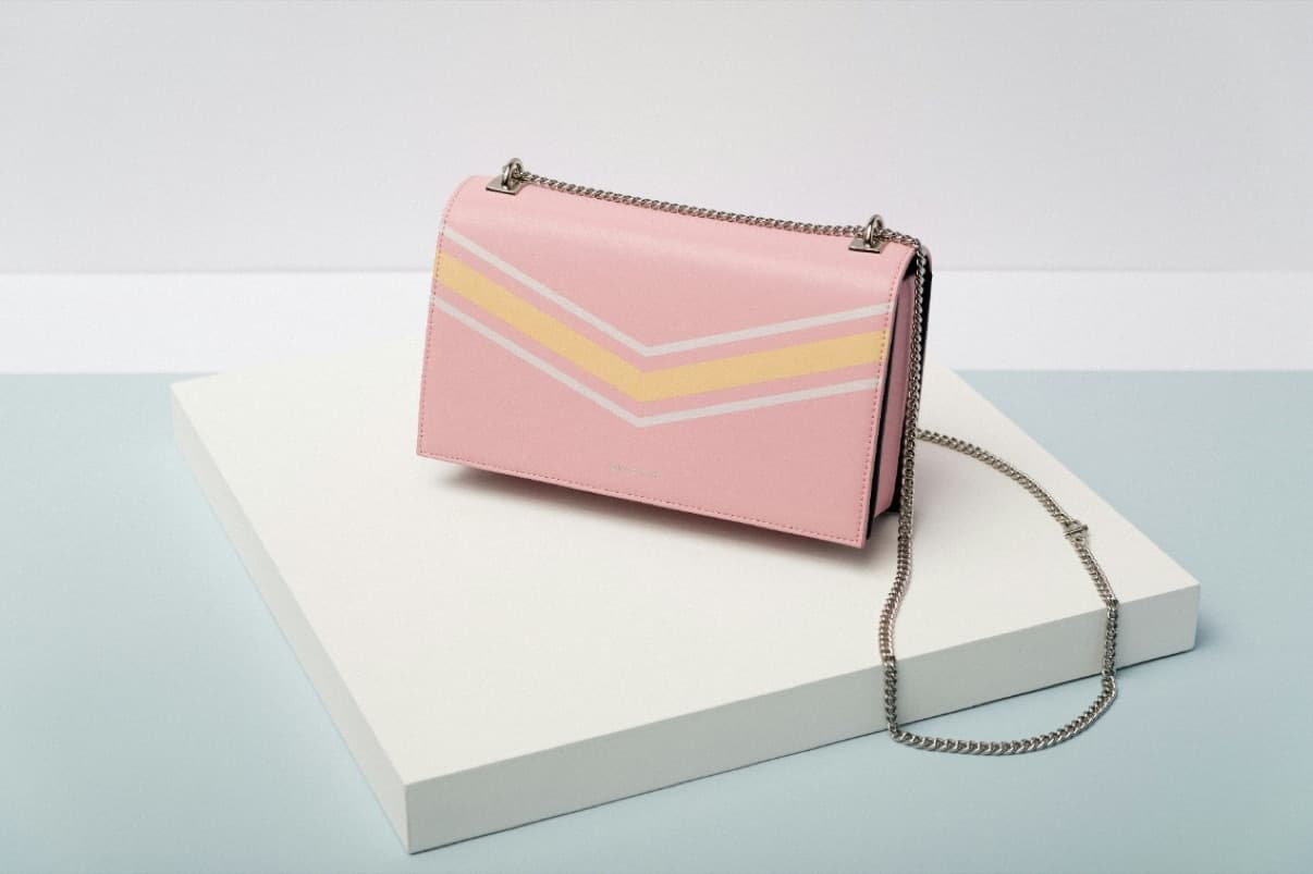 A pink leather bag with a chain strap